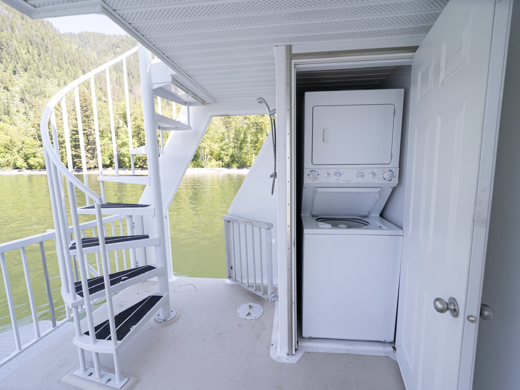 Rear deck, spiral stairs and lake access